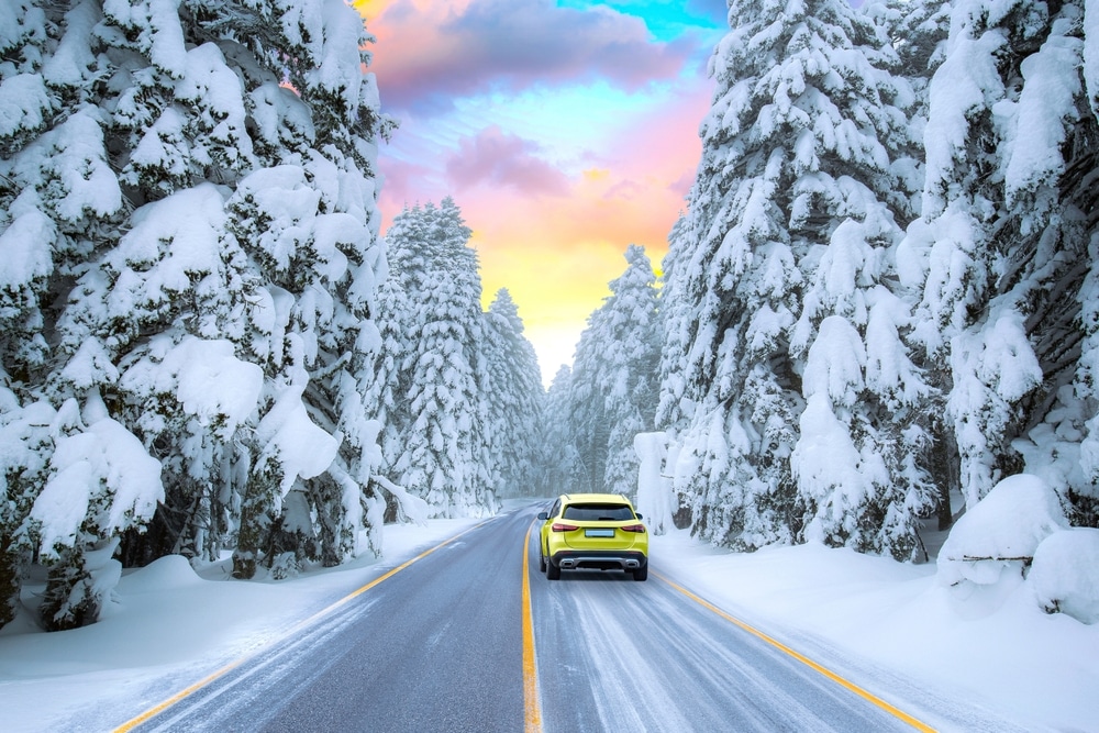 A faraway view of a car in snow