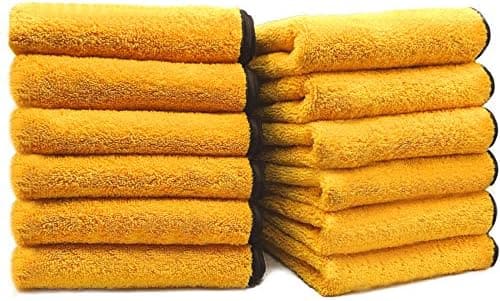 A pile of yellow Solid Multipurpose Plush car towels