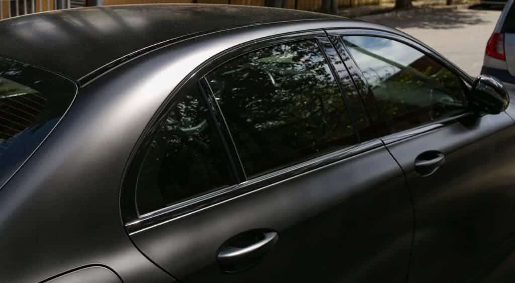 a black color car with tinted windows