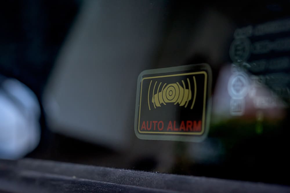 A view of an auto car alarm sticker on a car screen