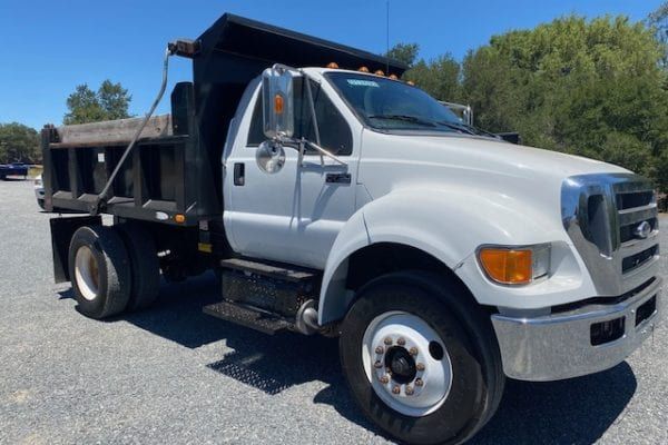 A view of a axle dump truck