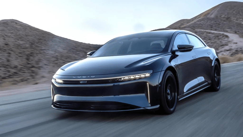 A view of a black lucid air speeding on road