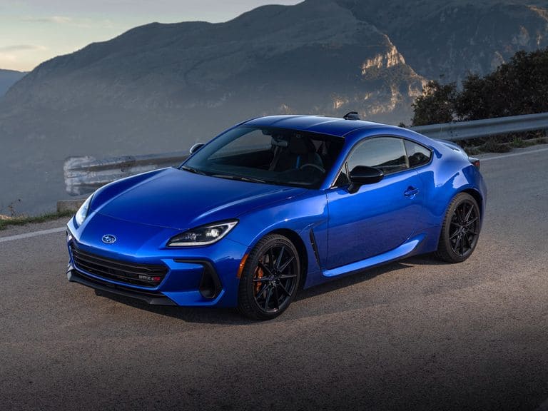 A view of a blue subaru brz sports car on road