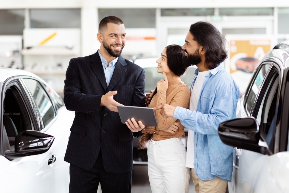 A view of a person selling out their car