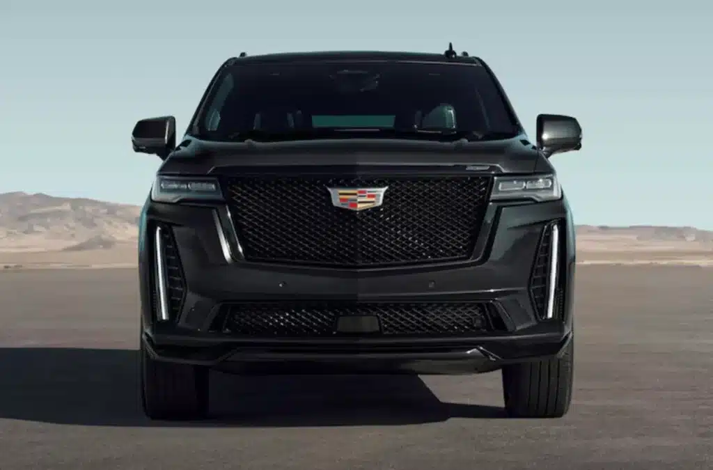 A front view of a black Cadillac escalade