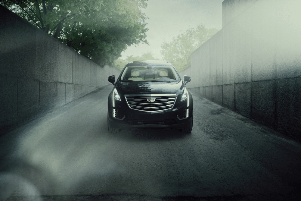 A front view of a black cadillac car