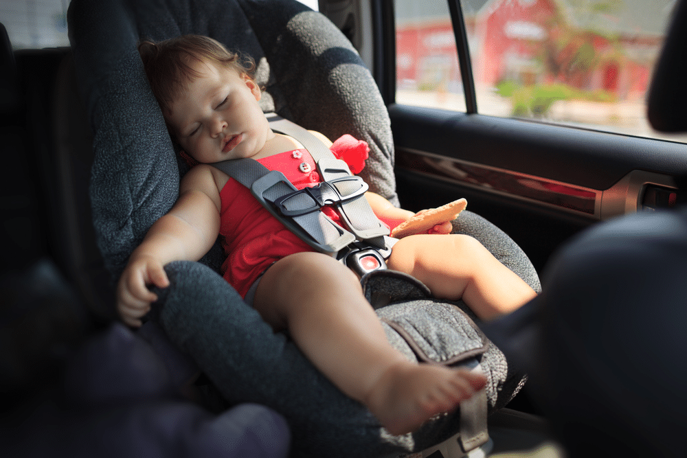 A view of a baby sleeping in an infant car seat