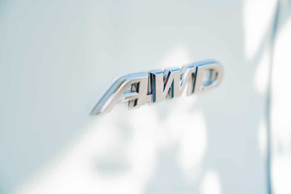 A view of a silver AWD inscribed on a white car