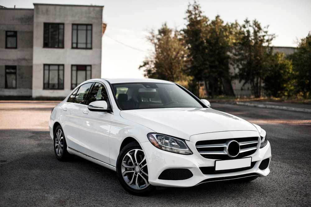 A front view of a white luxury sedan